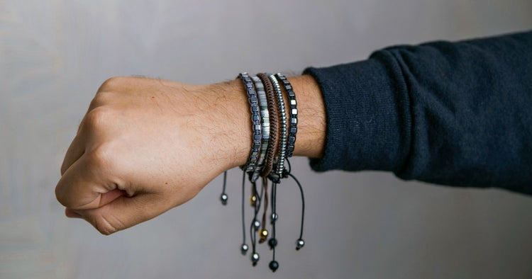 Man's hand wearing leather bracelets — men's style accessories gift guide India